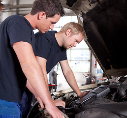 Image showing Mechanics Team with Diagnostics Equipment