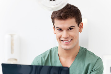 Image showing Young dental assistant smiling