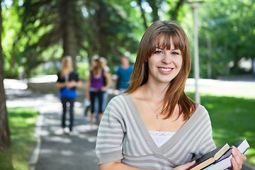 Image showing Portrait of smiling young college girl