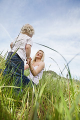 Image showing Mother and little boy in grass