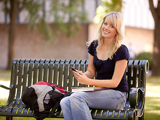 Image showing Attractive Student Sending Text Message