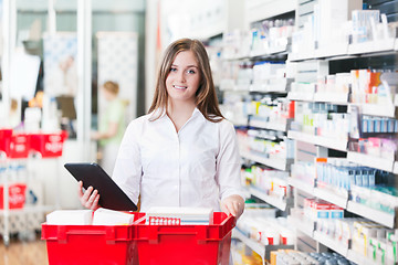 Image showing Female Chemist Holding Tablet PC