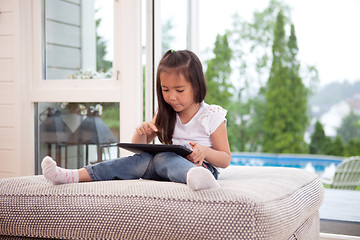 Image showing Child Playing with Digital Tablet