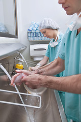 Image showing Surgeons washing hands