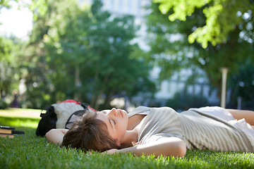 Image showing Girl asleep on the grass