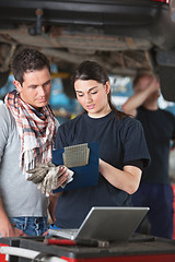 Image showing Female Mechanic Explaing Repairs to Client