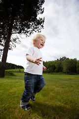 Image showing Excited Cheeful Boy Running