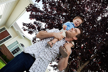 Image showing Boy on father's shoulders