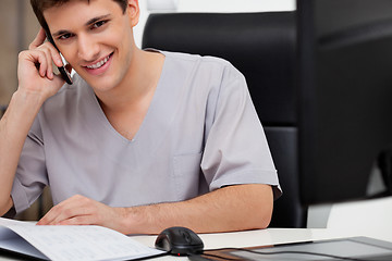 Image showing Doctor talking on phone