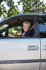 Image showing Pretty senior woman driving car