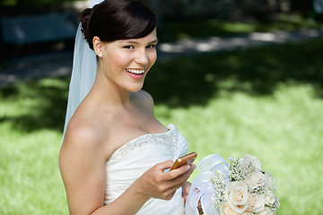 Image showing Bride Using Cell Phone