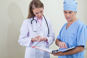 Image showing Doctor and nurse reading