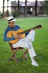Image showing Handsome Man Playing Guitar