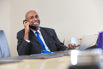 Image showing Businessman talking on telephone