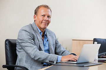 Image showing Businessman working on laptop