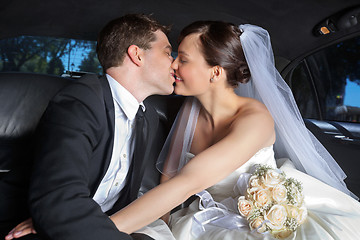 Image showing Wedding Couple Kiss in Limo