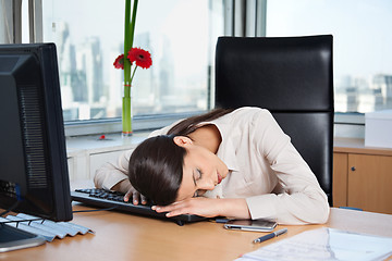 Image showing Tired Businesswoman Sleeping in Office