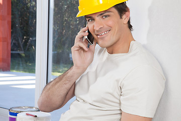 Image showing Construction worker on cellphone