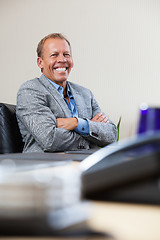 Image showing Portrait of executive sitting with hands folded