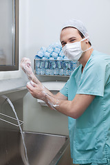 Image showing Male doctor washing hands