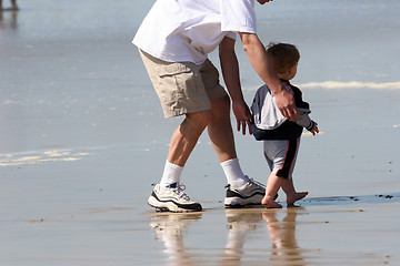 Image showing Father and son on the beach