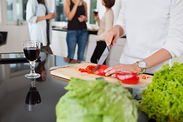 Image showing Cropped image of female cutting vegetables