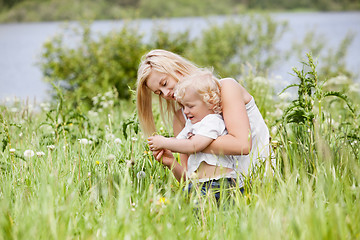 Image showing Mother and child in grass