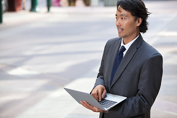 Image showing Business Man with Laptop Outdoors