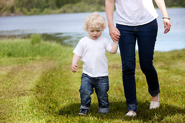 Image showing Mother and Son Walking Near Lake