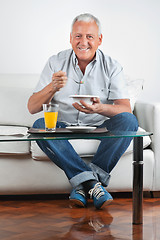 Image showing Senior Man Having Breakfast