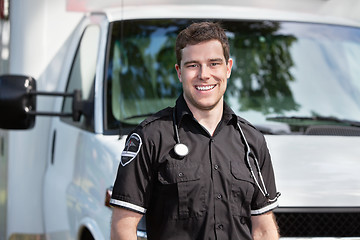 Image showing Paramedic Man Standing near Ambulance