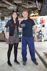 Image showing Portrait on mechanic and female customer