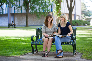 Image showing Happy College Students on Bench