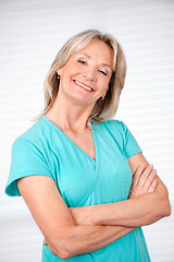 Image showing Cheerful Mature Woman With Arms Crossed