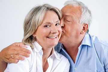 Image showing Woman Being Affectionately Kissed By Her Husband