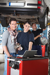 Image showing Portrait of garage worker and client
