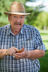 Image showing Senior Man Writing Text message