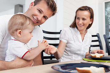 Image showing Family sitting at breakfast table