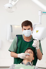 Image showing Man Dentist Preparing X-ray