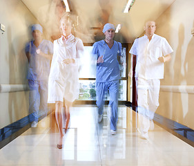 Image showing Team of doctor and nurse running