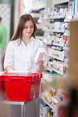 Image showing Female Holding Medicine Box