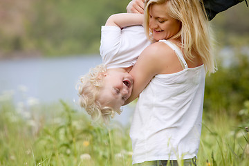 Image showing Mother and Son Playing in Meadow