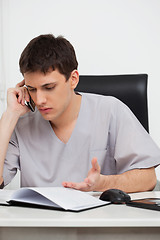 Image showing Doctor on cellphone