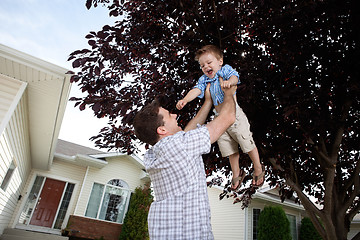 Image showing Father Lifting Son in Air