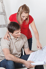 Image showing Couple with Blueprints