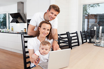 Image showing Happy family with laptop