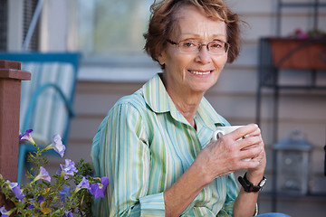 Image showing Senior Woman with Warm Drink Outdoors