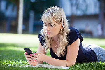 Image showing Young girl using cell phone