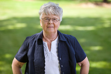 Image showing Senior woman standing in park