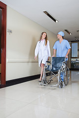 Image showing Doctor walking with male nurse